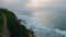 Grassy hill ocean side drone view. Gloomy sea beach cliff nature slow motion