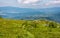 Grassy hillside with huge boulders