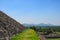 Grassy pathway and closeup of pyramid\'s wall at Teotihuacan