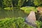 Grassy shore with wooden bridge on Bakomi tajch water reservoir in Stiavnicke Vrchy mountains