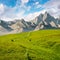 Grassy slopes and rocky peaks composite