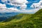 Grassy slopes under the beautiful cloudscape