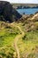 Grassy track leading down to Hells Mouth near Hayle in Cornwall