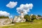 Grassy yard and limestone rocks surrounding medieval Ogrodzieniec Castle in Podzamcze village in Silesia region of Poland