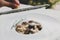 Grate parmesan on wild mushrooms porcini risotto, italian cuisine closeup