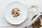 Grate parmesan on wild mushrooms porcini risotto, italian cuisine top view