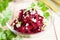 Grated beets and garlic in a transparent bowl