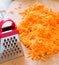 Grated carrots and a small grater