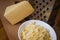 Grated Dutch cheese in a plate on a board