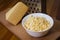 Grated Dutch cheese in a plate on a board