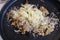 Grated parmesan cheese on top of mushroom risotto plate