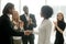 Grateful boss handshaking promoting african businesswoman congra