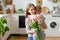 Grateful mother with bouquet hugging son