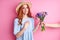 grateful redhead woman is happy to get flowers by suitors