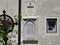 The grave of Franz Gruber, the composer of the song Silent Night, and the facade of his museum house with panels, Hallein, Austria