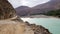 Gravel balcony road along to river middle of mountains