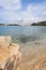 Gravel beach with rocks on the croatian Coast, clear water