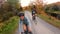 Gravel biking in fall. Woman biker riding bicycle on autumn forest trail. Selfie video by woman living healthy outdoor