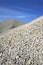 Gravel gray mound quarry stock blue sky