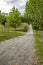 Gravel paved lane in countryside leading to the distance