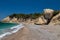 Gravel / pebble beach Akra Fourni nearby Monolithos  at Rhodes island with multi colored ocean water and rock formation