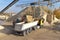 Gravel pit: building and wheel loader loading gravel onto a truck