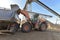 Gravel pit: building and wheel loader loading gravel onto a truck