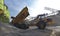 Gravel pit: building and wheel loader loading gravel onto a truck