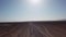 Gravel road in aerial desert. Sandy landscape, nobody. Nature in Namibia, Africa