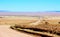 Gravel road through the golden dune