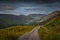 Gravel road leading to direlict house in The Black Valley, Co.Kerry, Ireland, Europe reminds of times past. 2019