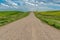 Gravel road leading to the historic, yet abandoned Peace Lutheran Church in Stonehenge, SK