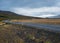 Gravel road and mountain view during auto trip in Iceland. Spectacular autumn Icelandic landscape with  scenic nature