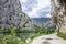 Gravel road through mountains and trees, Omis, Croatia