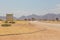 Gravel road with sign Welcome. Solitaire, Namibia