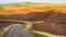 Gravel road sweeping through the Palouse