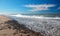 Gravel and Seafoam waves on beach at McGrath State Park in Ventura - Oxnard California USA