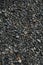 Gravel texture. Small stones, little rocks, pebbles in many shades of grey, white and blue. Texture of little rocks, background