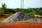 Gravels for construction works piled up on the ground.