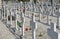 Graves headstones and crucifixes of a cemetery