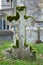 Gravestone cross  old tombstone with moss  UK