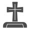 Gravestone solid icon. Cemetery box with christian cross. Halloween party vector design concept, glyph style pictogram