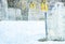 Gravestones and Church in Snowy Cemetery