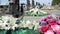 Gravestones and flowers in Catholic Cemetery. Graves and Tombstones. Black headstones in graveyard. Floral decoration and tombs. M