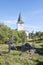 Graveyard crosses and white church in Estonia