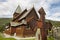 Graveyard rusted catholic cross. Norwegian stave church. Roldal