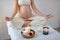 Gravid Young Female Practices Yoga In Bright Room, Health During Pregnancy