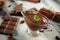 Gravy boat with tasty molten chocolate on wooden table