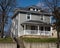 Gray American Foursquare House on Hill