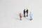 Gray Backgrond, Simple Illustration Photo for Mini Figure Two Man Toy Handshaking for Business Agreement Beyond their partner